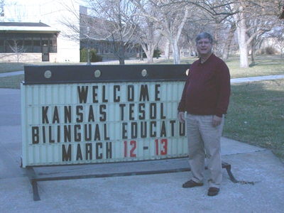 Steve Wolf helped to slot the letters for the outdoor KATESOL sign at Fort Hays