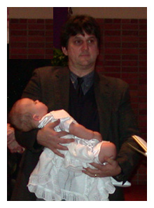 Robb Scott holds son Bill at recent baptism